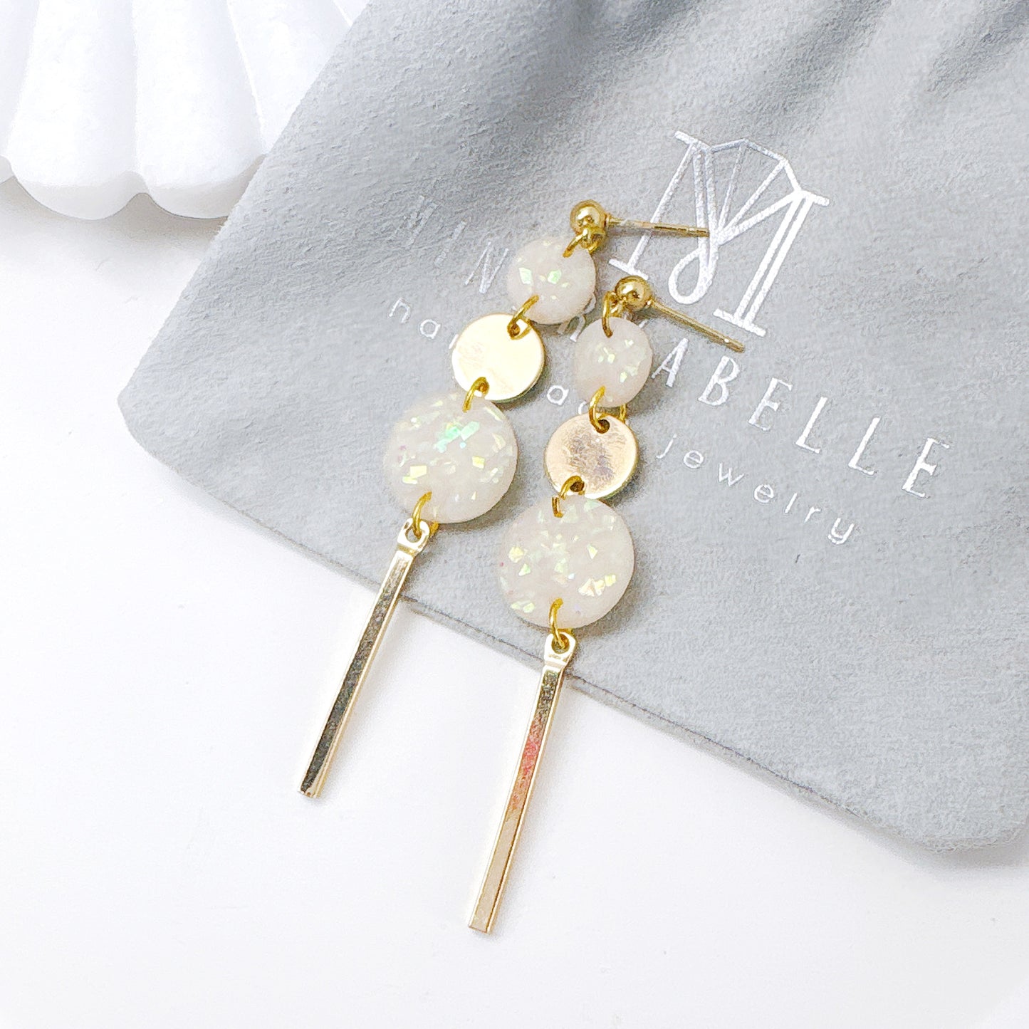 Silver and White Stone Triple Circle Bar Dangle Earrings