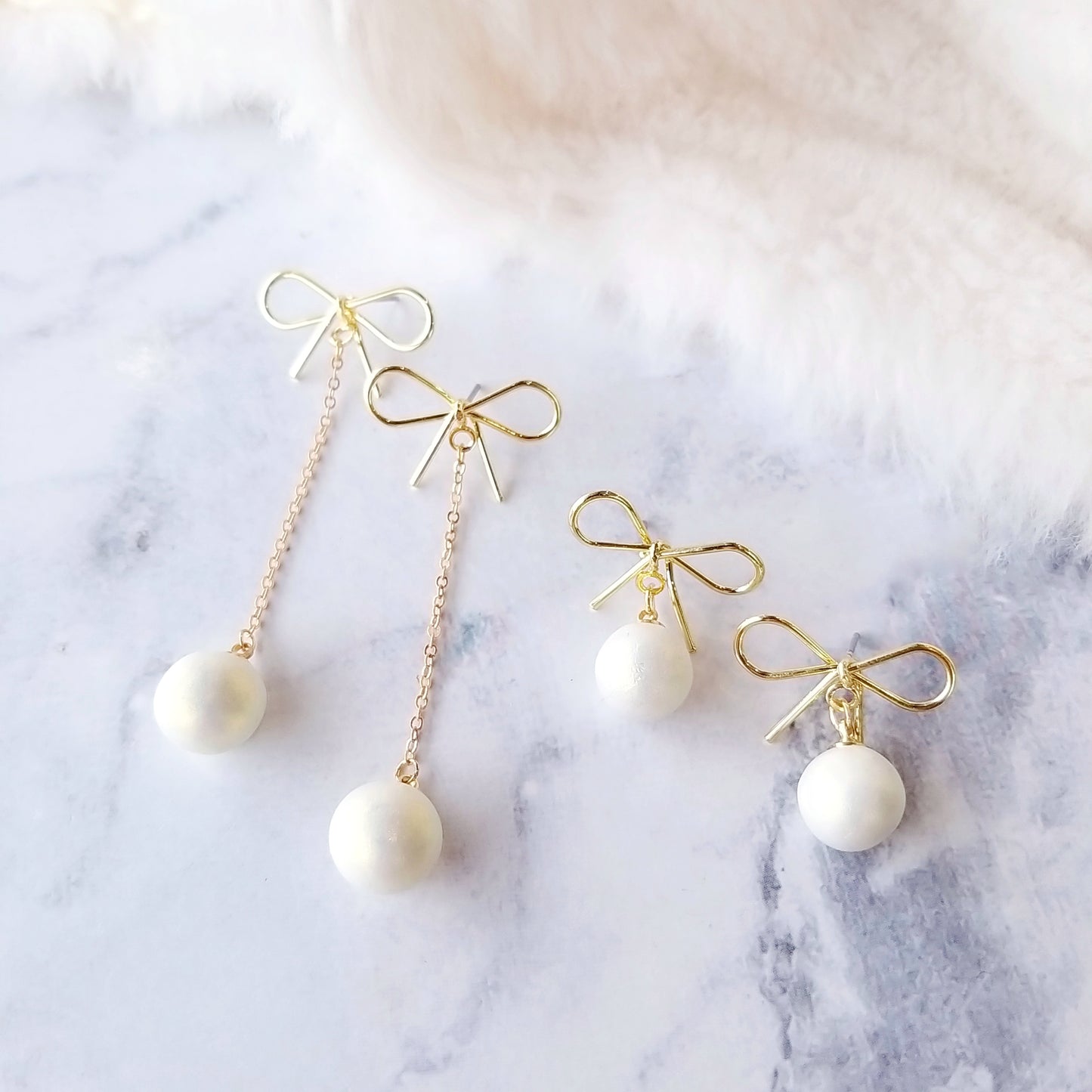 Golden bow pearl dangle earrings, handmade with surgical-steel posts